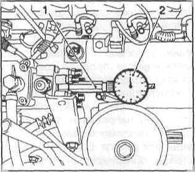 Înșurubați adaptorul (1) și indicatorul cadran (2) în loc de șurubul de fișă și strângeți-l ușor…