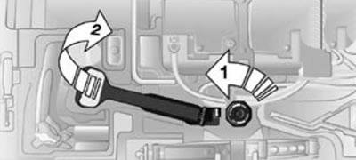 1. Выверните винт, см. стрелку 1.